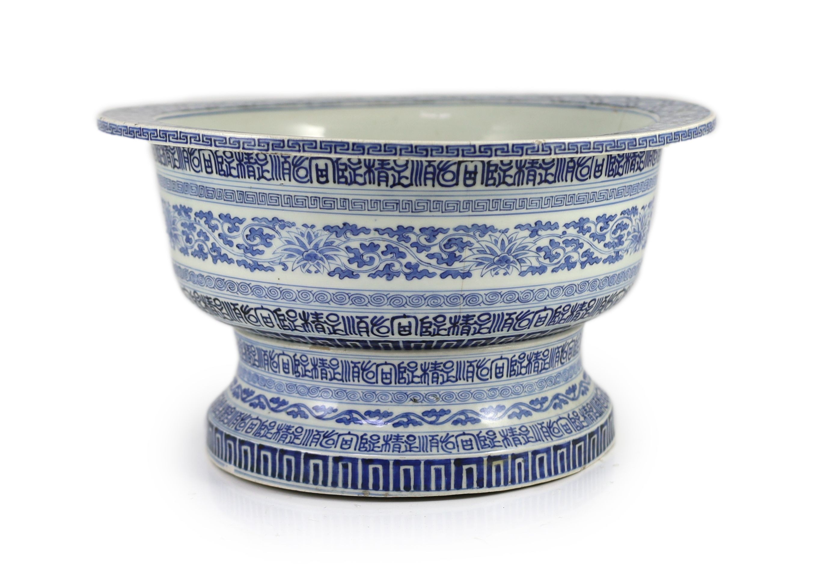 A unusual Chinese blue and white pedestal bowl or basin, 19th century, 34cm diameter, cracks